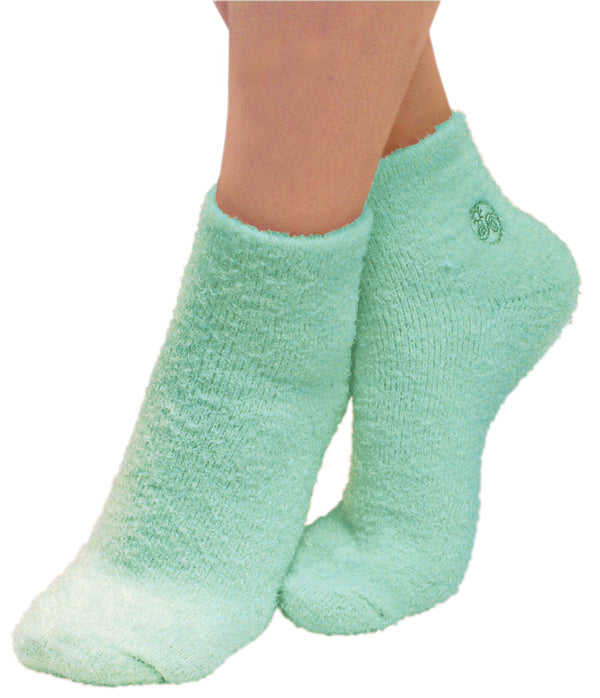 green aloe socks on feet