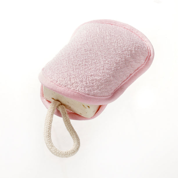Top image of Exfoliating Hydro Soap Sac outside of the package. It is pink and oval with a small white strap. A bar of soap is in the gap, showing how it would be used.